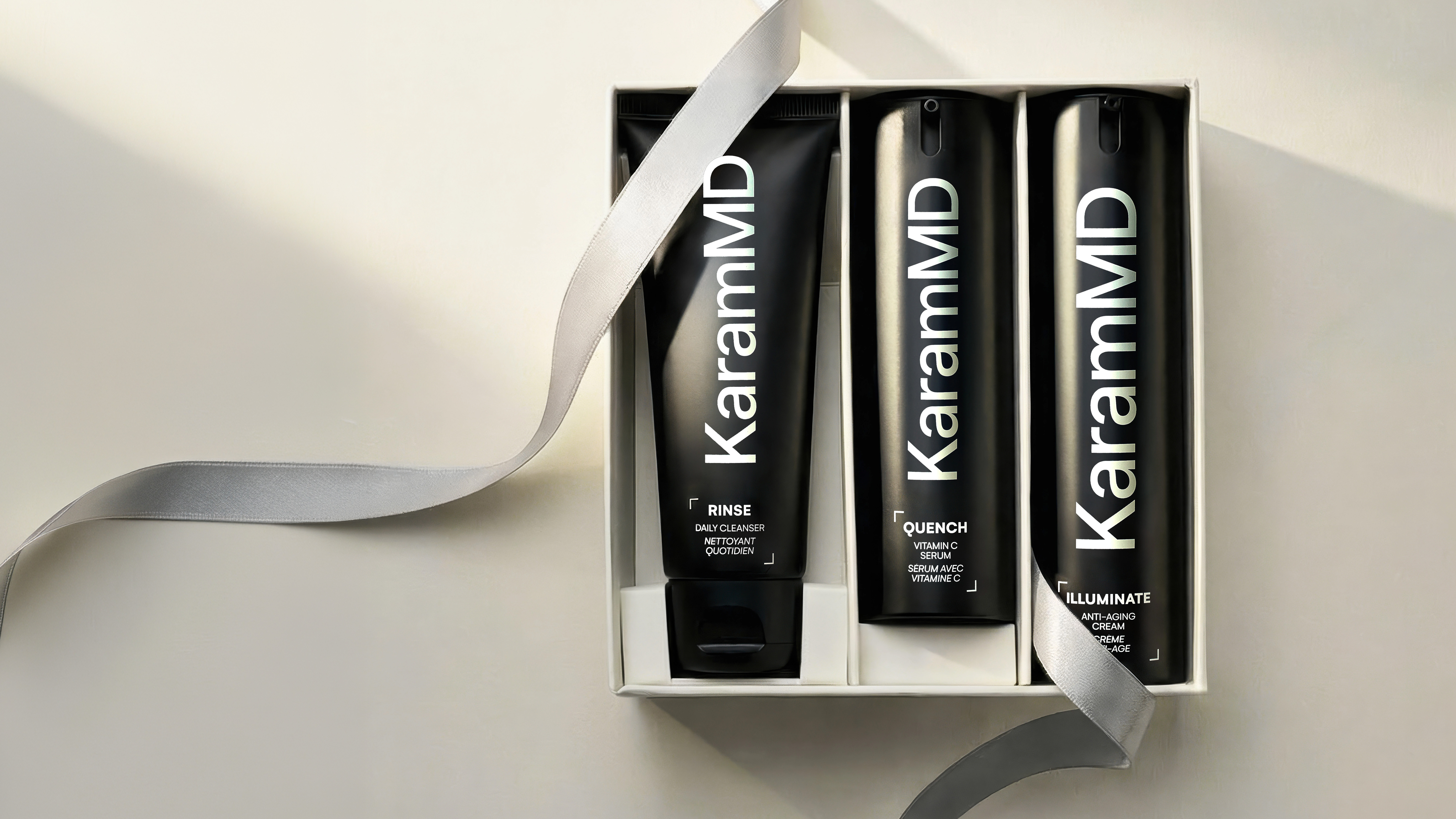 KaramMD holiday gift set — Rinse, Quench, and Illuminate in a white presentation box with satin ribbon